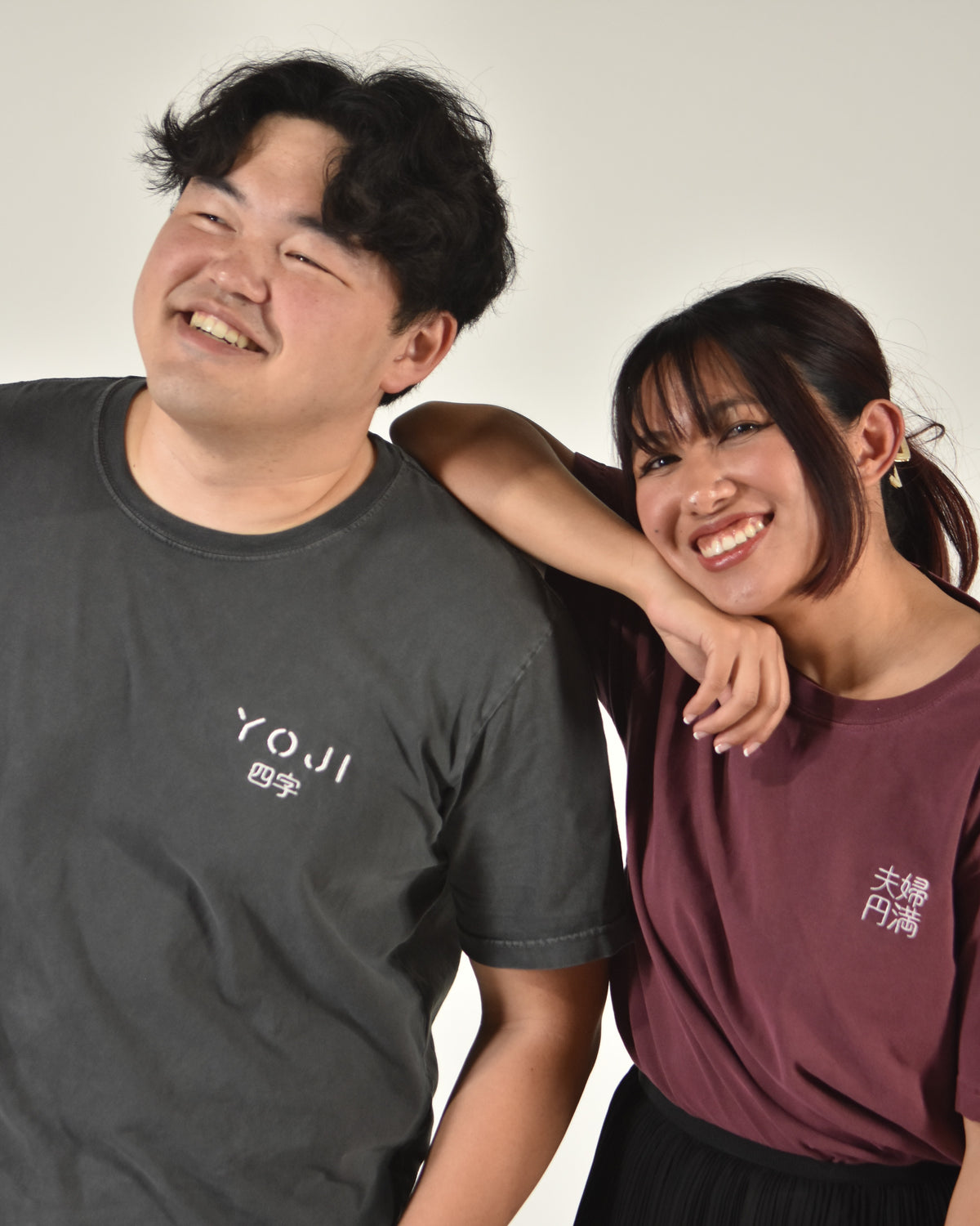 夫婦円満 happily married shirt in washed maroon, worn by a model next to a friend
